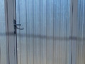 калитка из оцинкованного профнастила крупным планом